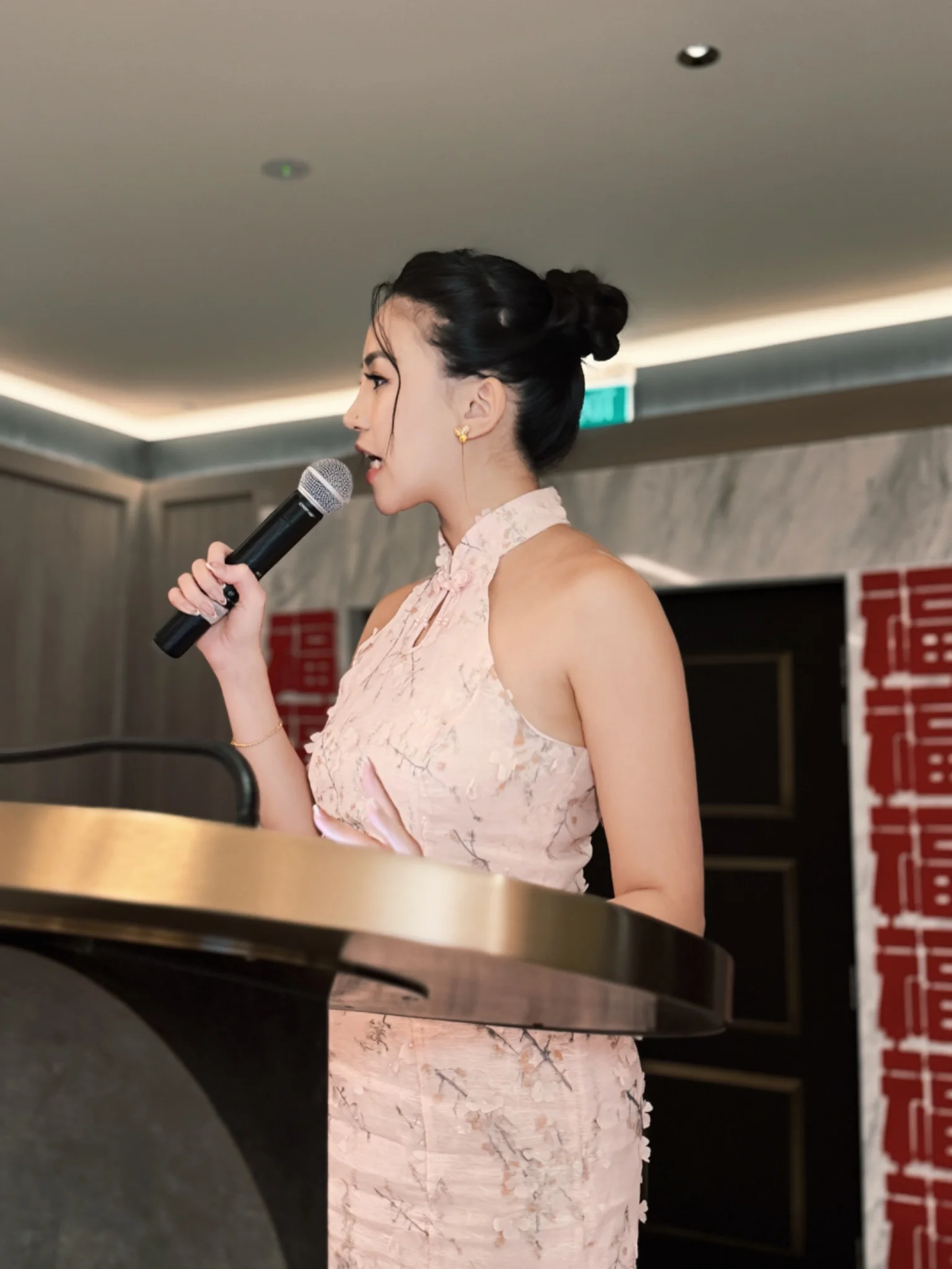 Fiona Loh presenting at a bilingual event