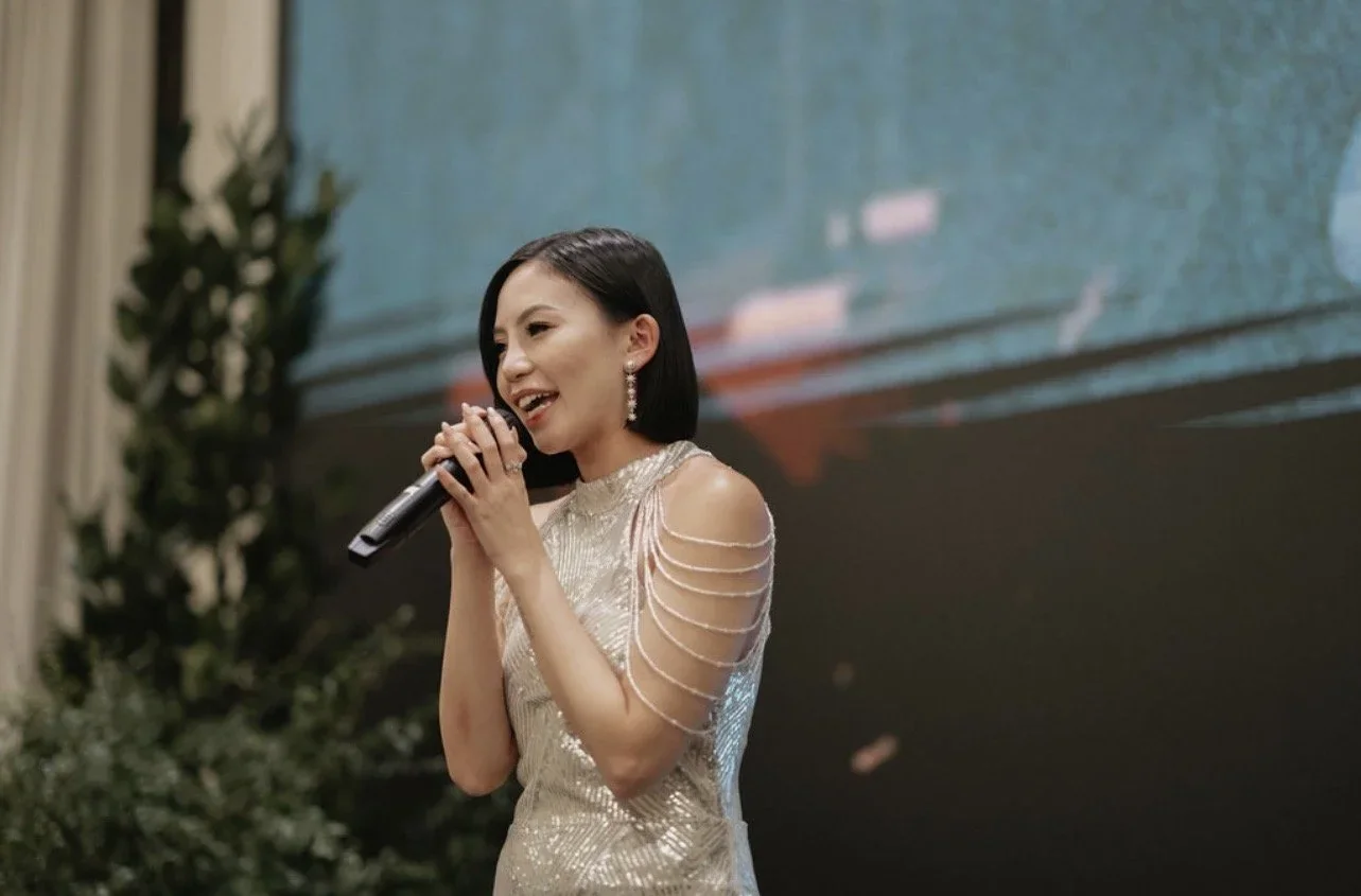 Fiona Loh hosting a corporate event in Singapore